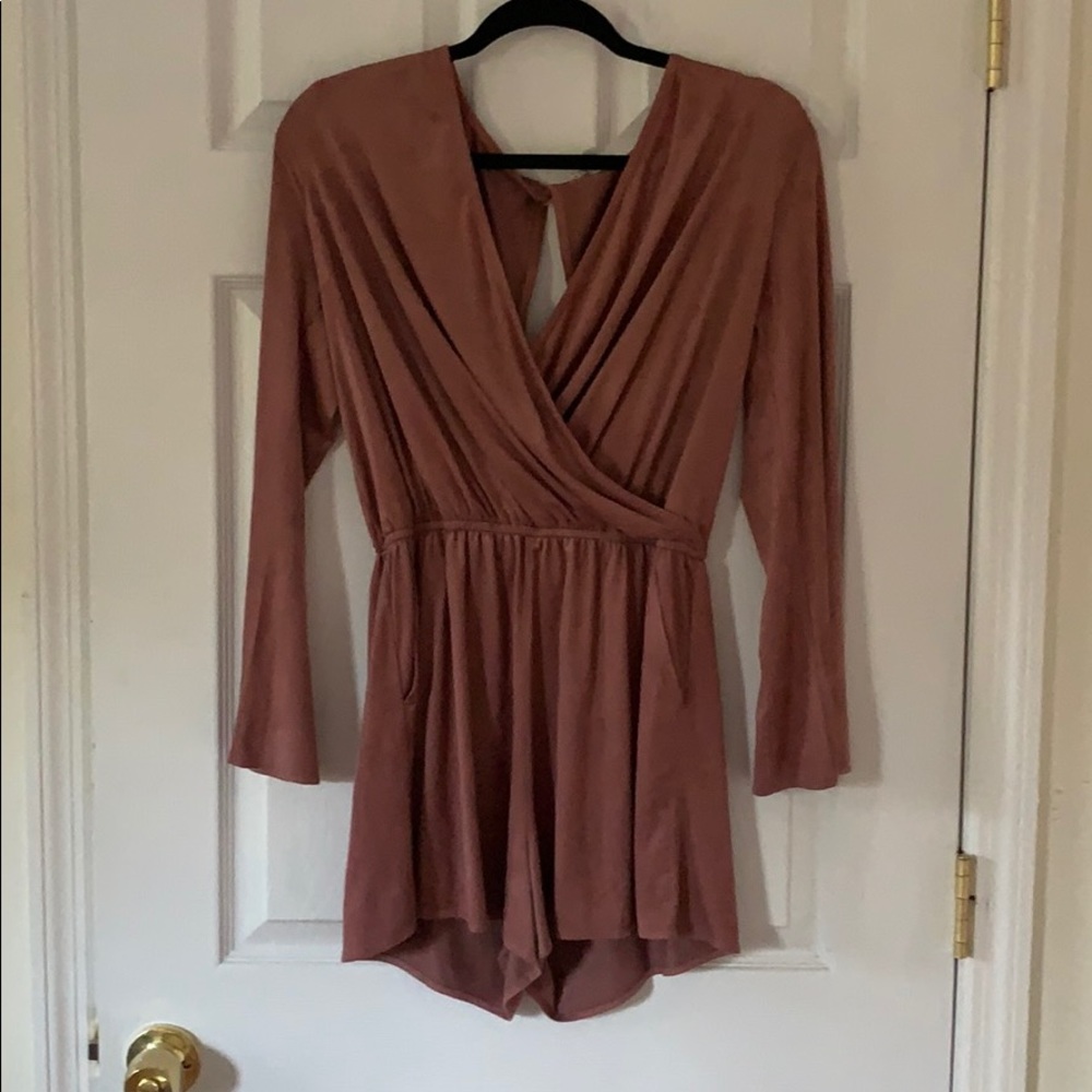 Women’s mauve romper with pockets.